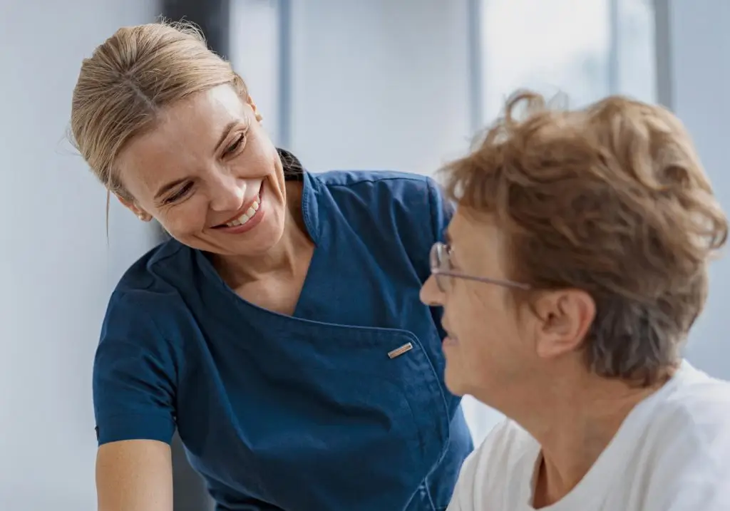 Picture of a PT physician helping a patient.