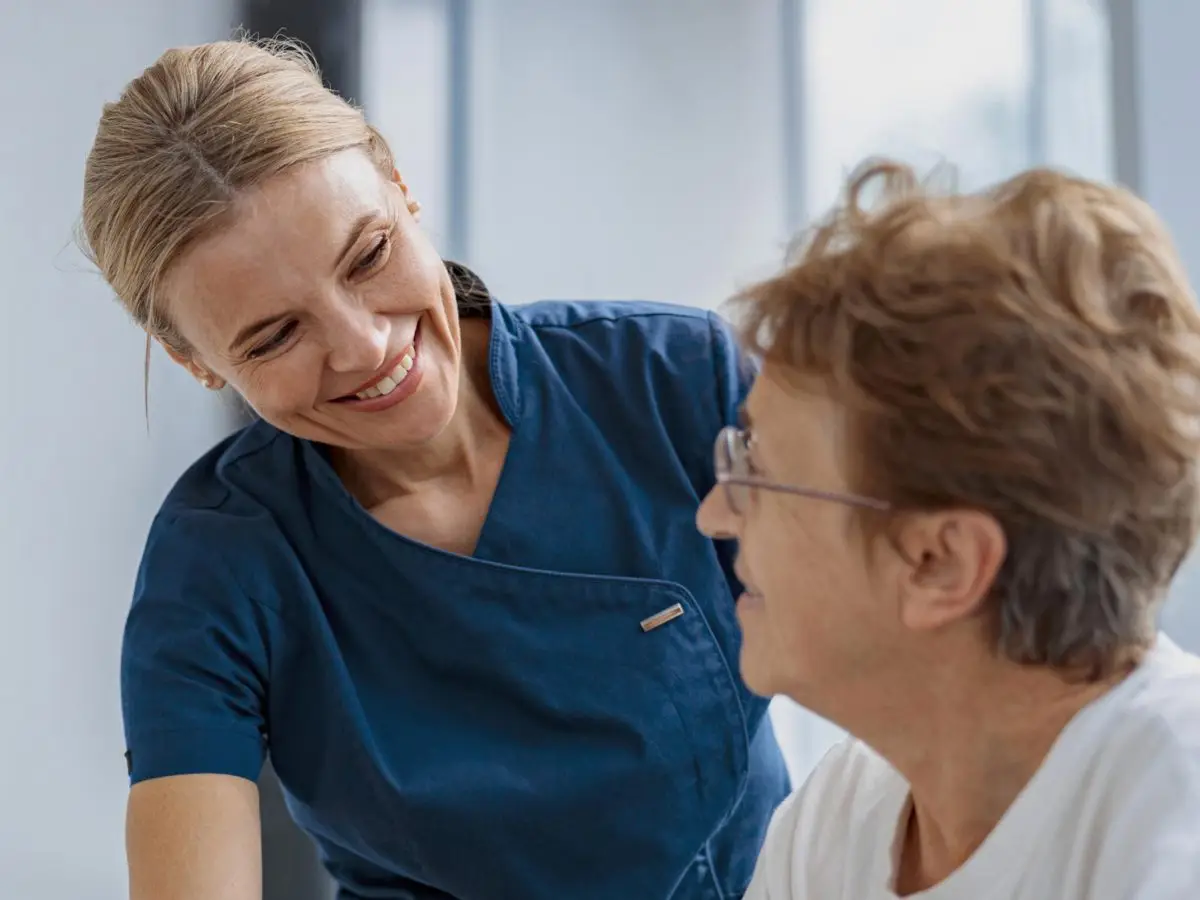 Picture of a PT physician helping a patient.