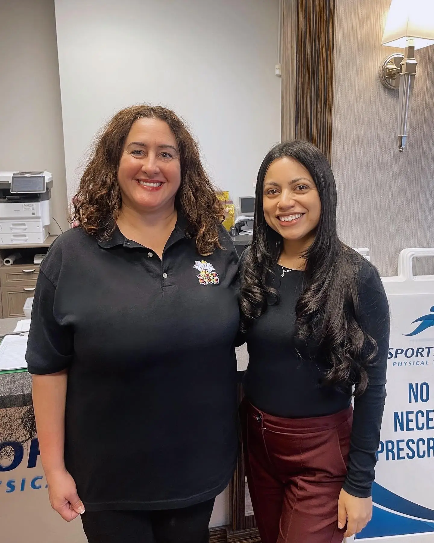 Two staff members from SportsMed Physical Therapy North Bergen NJ