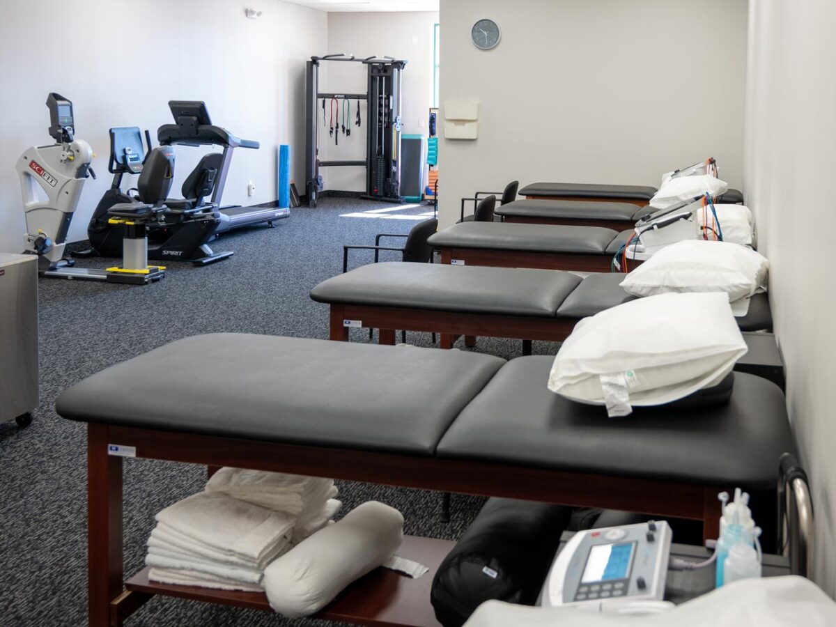 SportsMed Physical Therapy - Belleville, New Jersey - treadmills, weight machines, equipment storage and PT tables