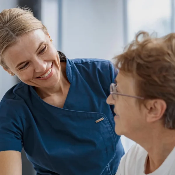 Picture of a PT physician helping a patient.
